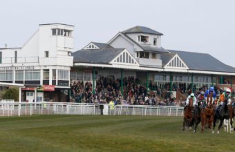 Horses round the bend after the straight with Catterick stands behind