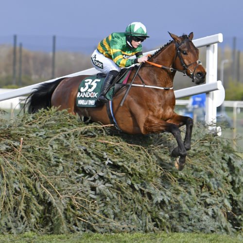 Minella Times and Rachael Blackmore taking a Grand National fence