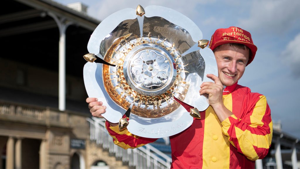 Tom Marquand with the 2020 St Leger trophy and cap