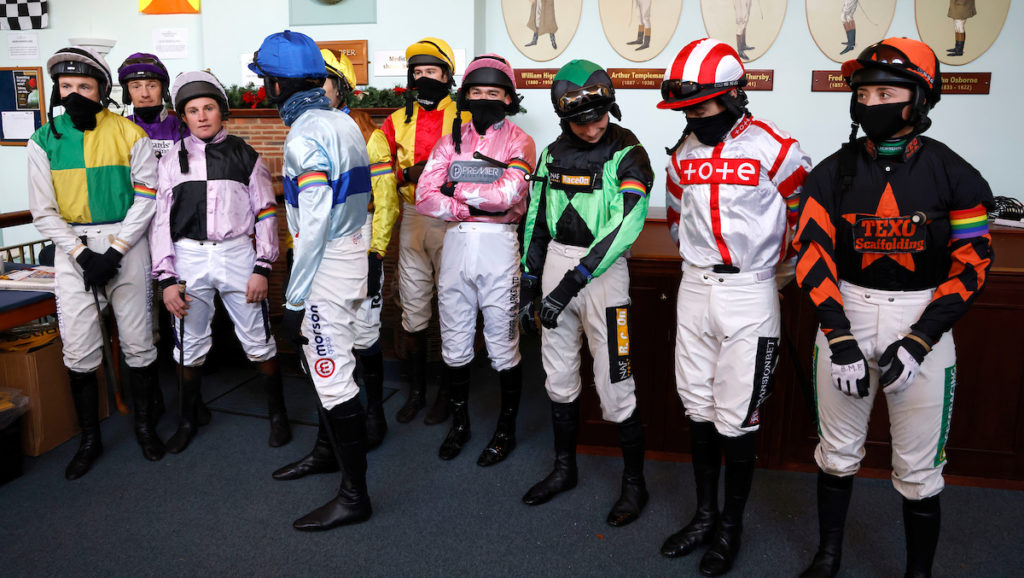 Racing Is Everyone's Sport. Jockeys' sporting rainbow armbands. The importance of allies