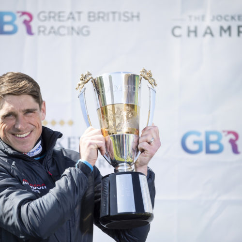Harry Skelton with the champion jump jockey trophy