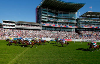 Field passing the grandstand and crossing the line at York