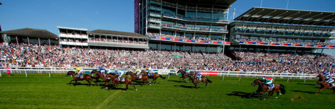 Field passing the grandstand and crossing the line at York