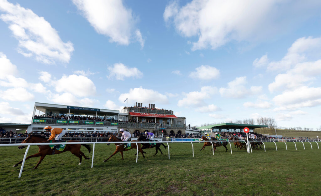 Runners go past the stand at Kelso