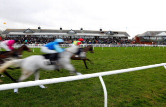 Runners passing the stands in The bet365 Auld Yin Conditional Jockeys' Veterans' Handicap Chase