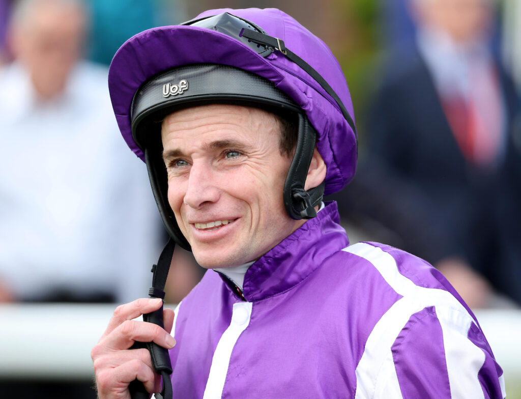 Ryan Moore about to do up helmet strap at york