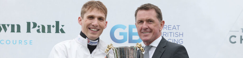 Sir A P McCoy presenting Harry Cobden Champion Jump Jockey trophy at Sandown