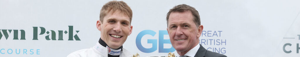 Sir A P McCoy presenting Harry Cobden Champion Jump Jockey trophy at Sandown