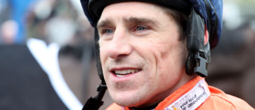 Harry Skelton looking past the camera with small mud splatters on him