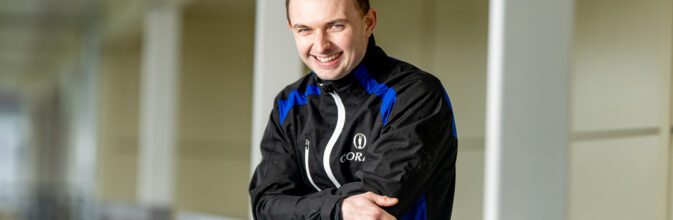Sean Bowen posing for the camera outside the weighing room