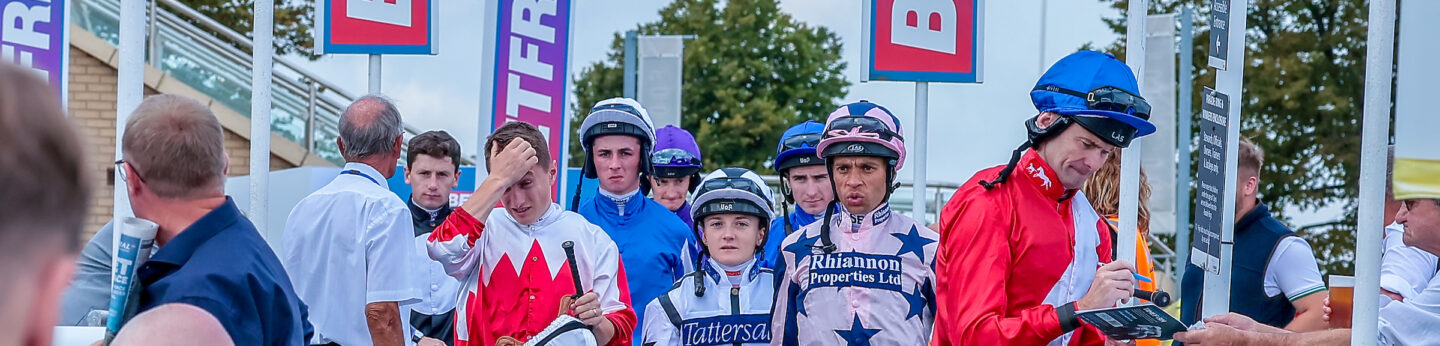 Robert Havlin leads out the jockeys for The Coopers Marquees EBF Maiden Fillies' Stakes at Doncaster