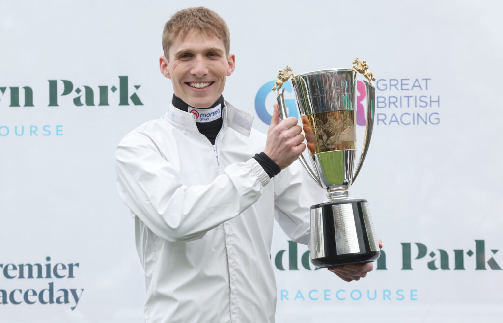 Harry Cobden with the Champion Jockeys' trophy in 2024 at Sandown