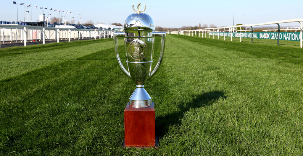 The David Power Jockeys’ Cup trophy, on the grass of the track at Aintree