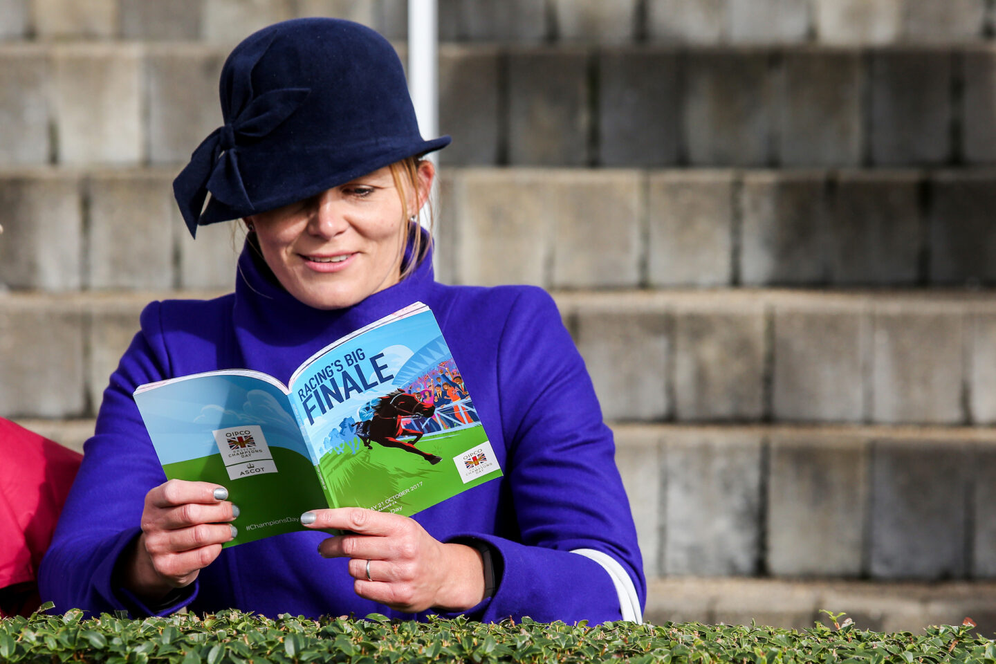 Woman reading a racecard